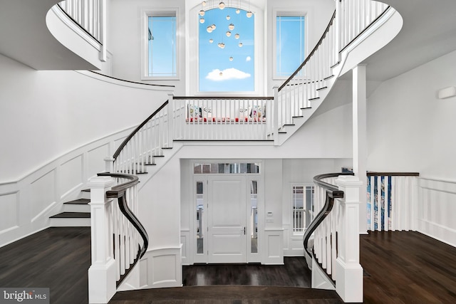 17-C Long Beach Blvd, Long Beach Township, NJ 08008 - foyer entrance featuring a decorative wall, wood finished floors, a high ceiling, stairway, and wainscoting