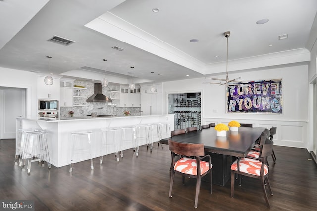 17-C Long Beach Blvd, Long Beach Township, NJ 08008 - dining area featuring a tray ceiling, dark wood-type flooring, recessed lighting, and crown molding