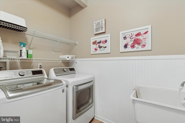 laundry room featuring independent washer and dryer and sink