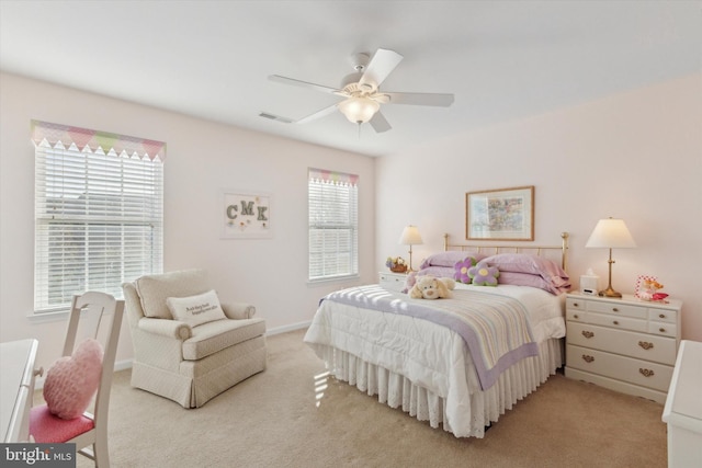 bedroom featuring ceiling fan and light carpet