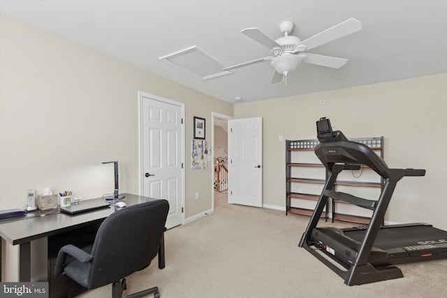 carpeted office space featuring ceiling fan