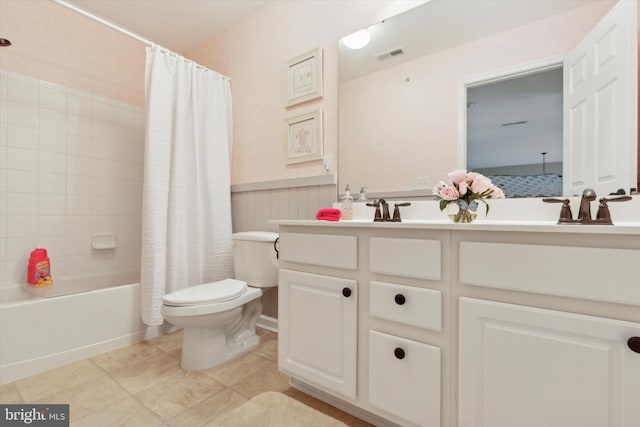 full bathroom featuring toilet, vanity, and shower / bathtub combination with curtain