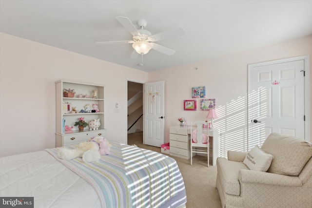 carpeted bedroom featuring ceiling fan