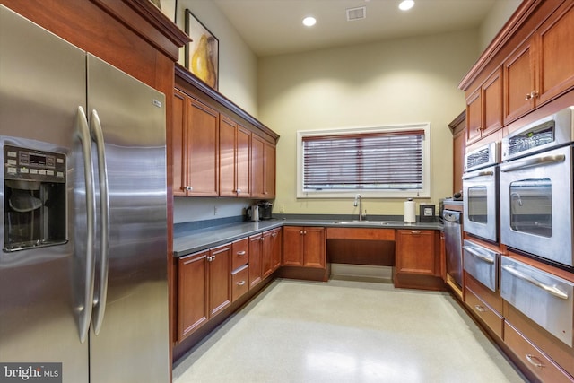 kitchen with sink and appliances with stainless steel finishes