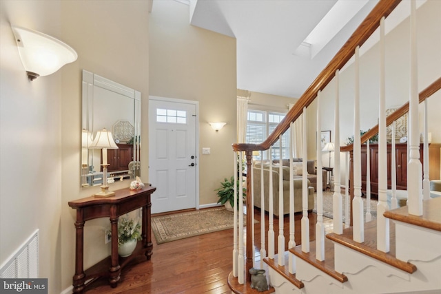 foyer entrance with hardwood / wood-style floors