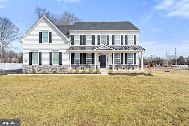 view of front facade with a porch and a front yard