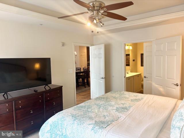 bedroom with ceiling fan and connected bathroom