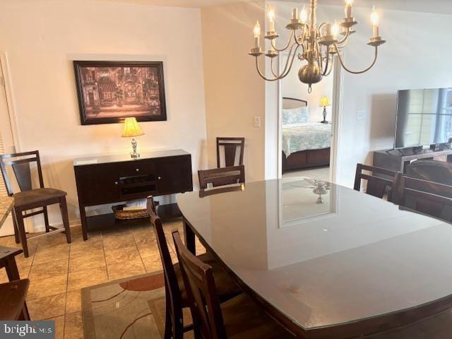 tiled dining area with a notable chandelier