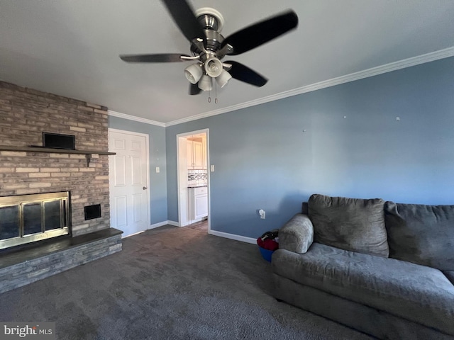 living room with ceiling fan, ornamental molding, a fireplace, and dark colored carpet