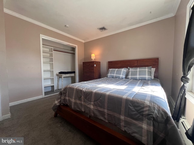 bedroom with ornamental molding, dark carpet, and a closet