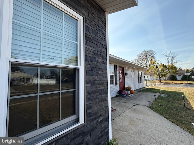 view of side of property featuring a patio