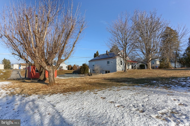 view of yard covered in snow