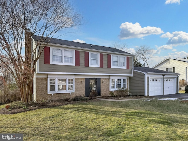 view of front of house featuring a garage and a front lawn