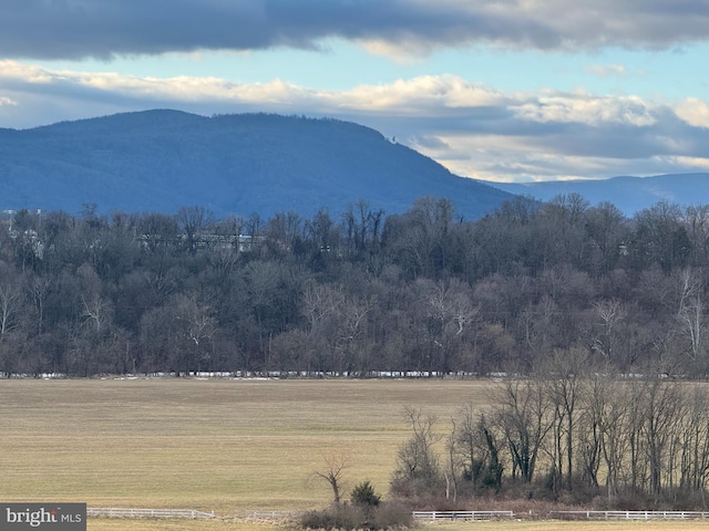 mountain view featuring a rural view and a wooded view