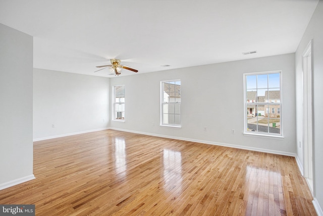 unfurnished room with ceiling fan and light hardwood / wood-style floors