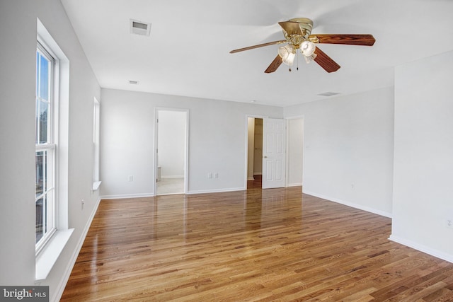 unfurnished room featuring hardwood / wood-style floors and ceiling fan