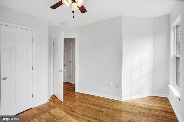 unfurnished bedroom with hardwood / wood-style flooring and ceiling fan