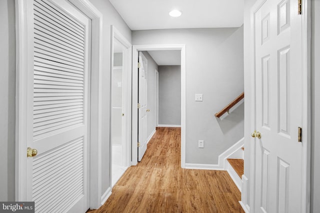 hallway with light wood-type flooring