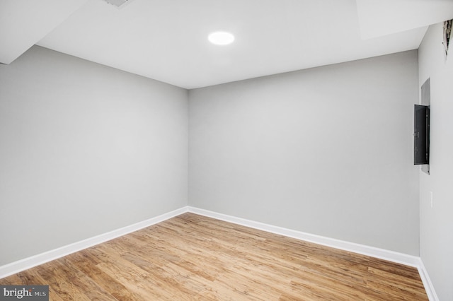 spare room with wood-type flooring