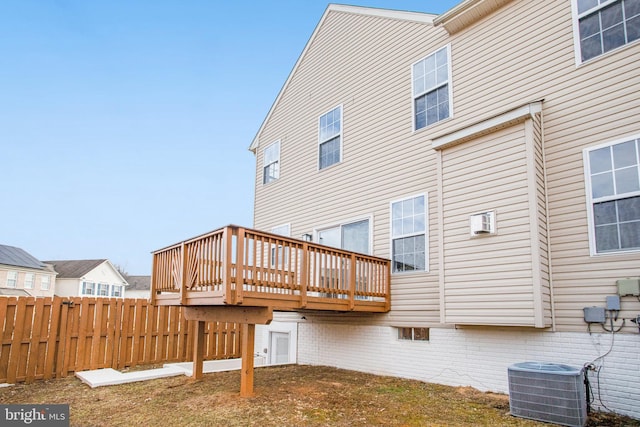 back of house with central AC and a deck