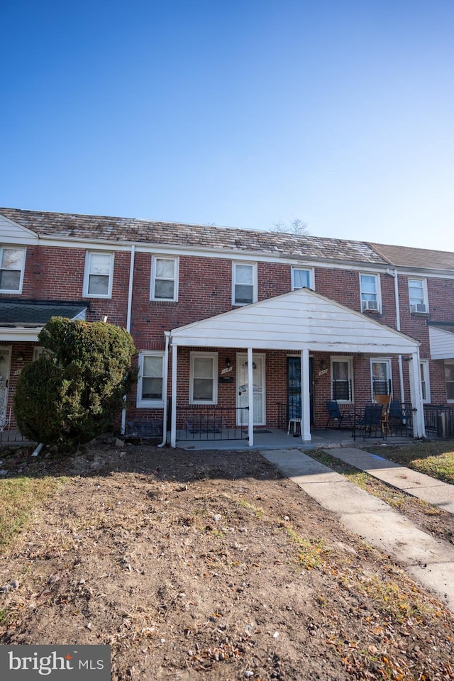 view of property featuring a porch