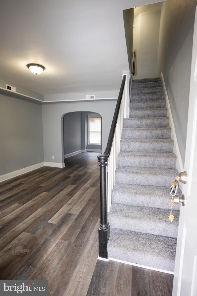 staircase featuring hardwood / wood-style flooring