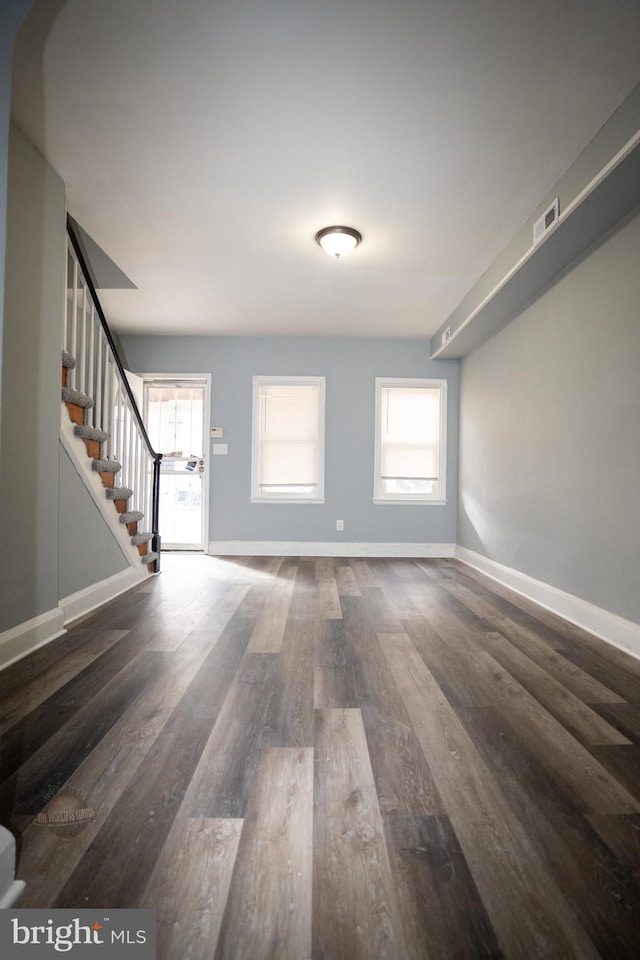 interior space with dark hardwood / wood-style floors