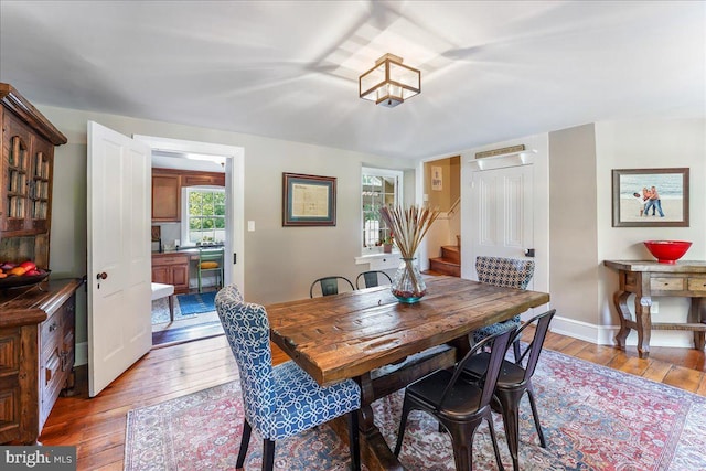 dining area featuring light wood-type flooring