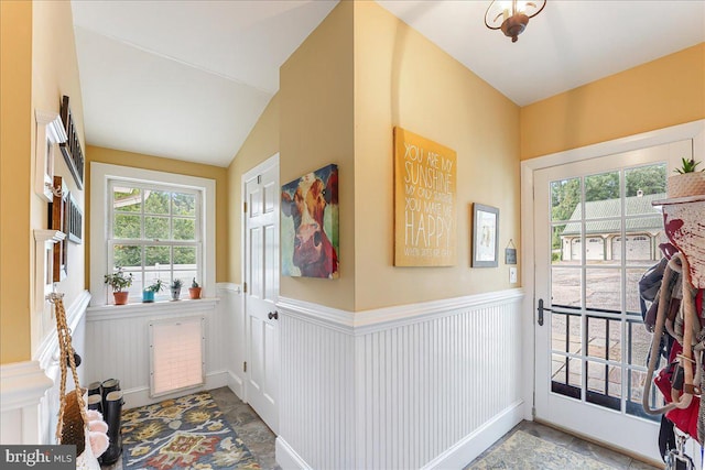 doorway with lofted ceiling