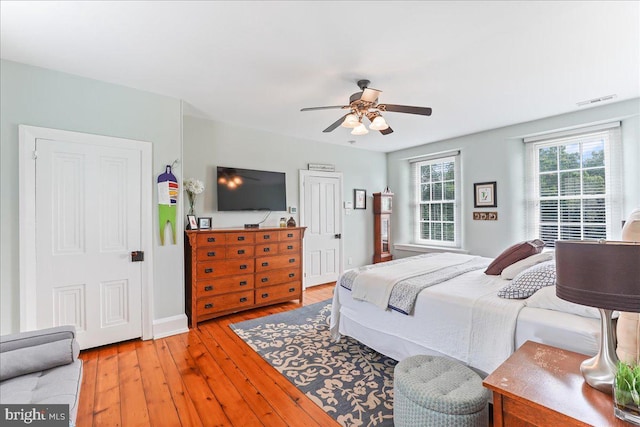 bedroom featuring light hardwood / wood-style floors and ceiling fan