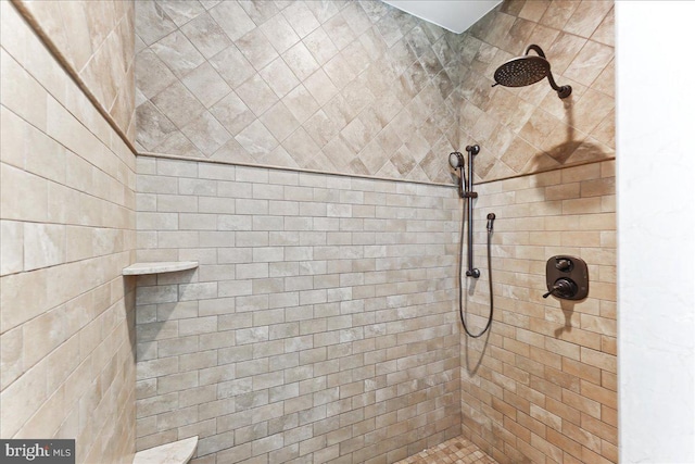 bathroom with tiled shower