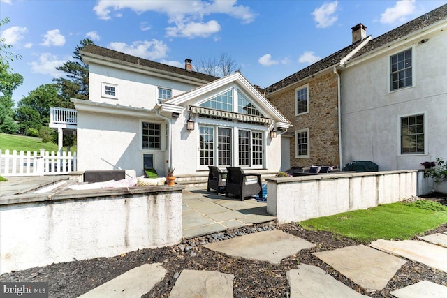 back of house featuring a patio