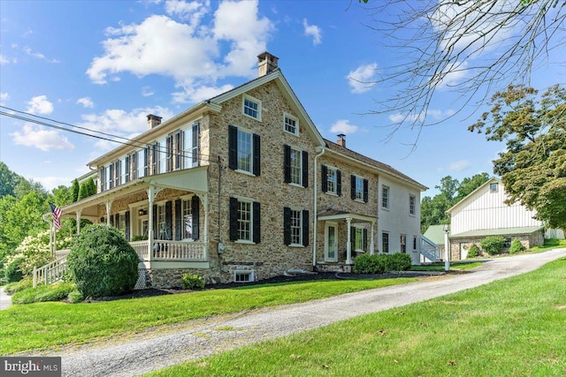 exterior space with a front lawn