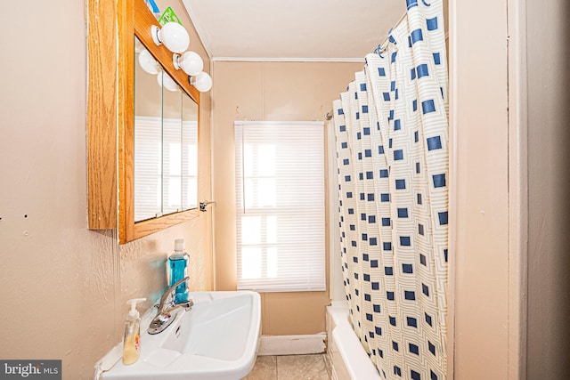 full bathroom with tile patterned flooring and a sink