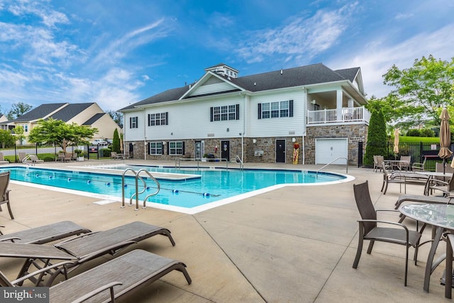 view of pool featuring a patio area