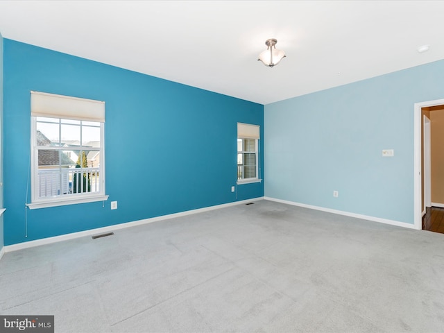 empty room with light colored carpet