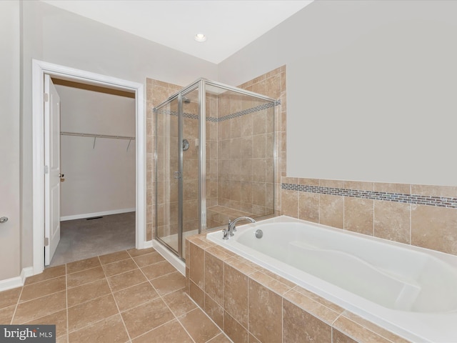 bathroom featuring separate shower and tub and tile patterned floors