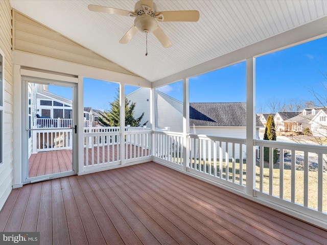 unfurnished sunroom featuring ceiling fan and lofted ceiling