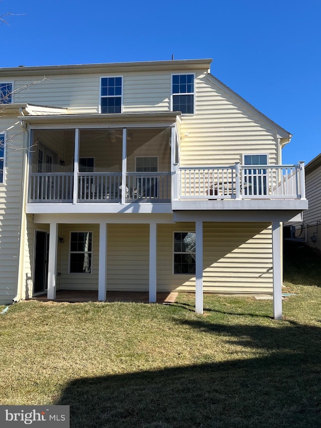 back of house with a yard