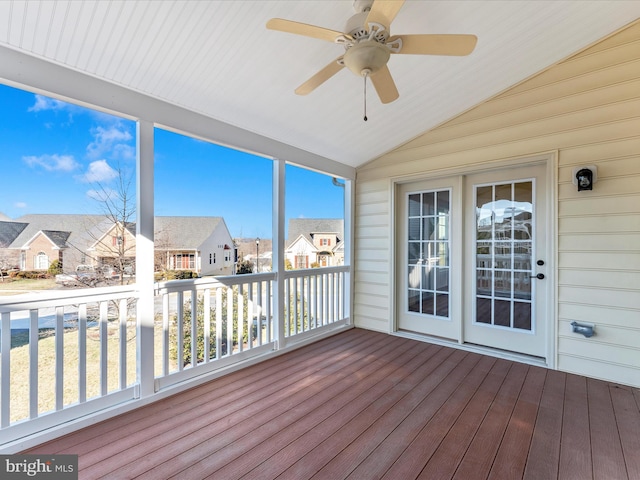 unfurnished sunroom featuring ceiling fan and lofted ceiling