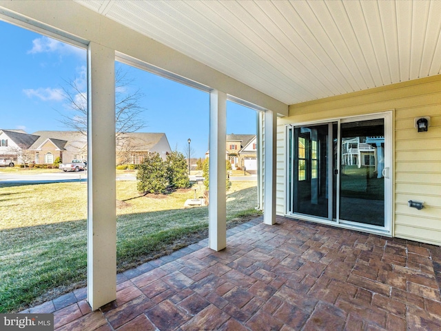 unfurnished sunroom featuring wood ceiling