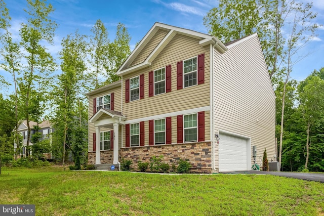 view of front facade with a garage and a front lawn