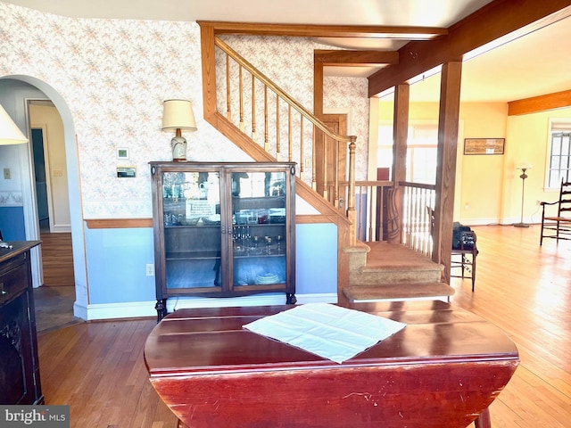 interior space featuring beam ceiling and hardwood / wood-style floors