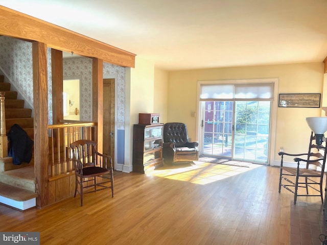 sitting room with hardwood / wood-style flooring