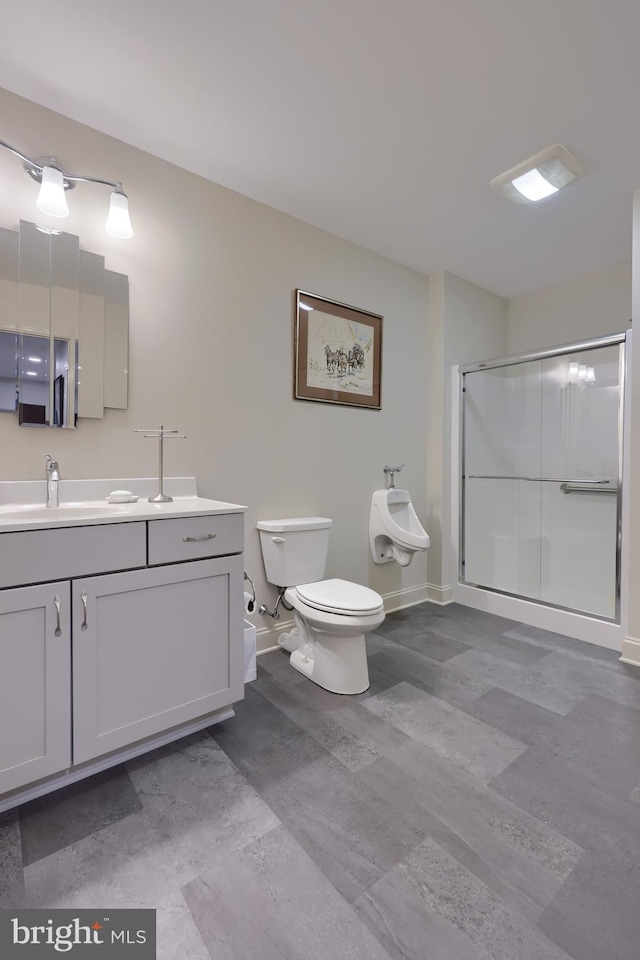 bathroom featuring walk in shower, vanity, and toilet