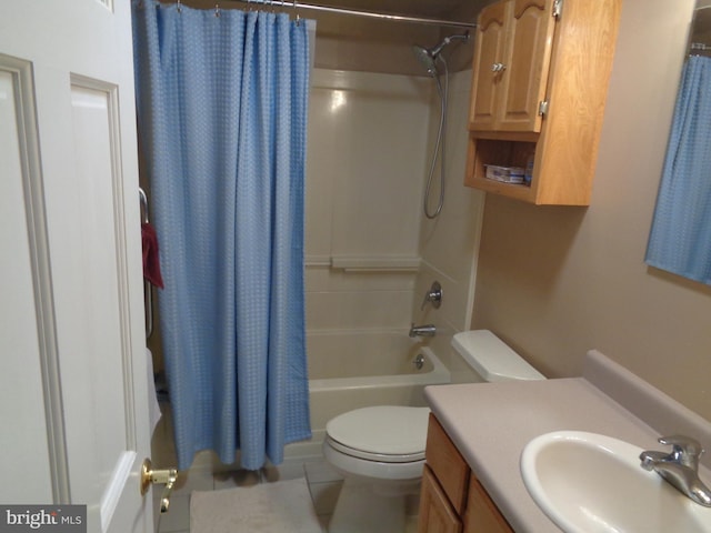 full bathroom featuring vanity, shower / bathtub combination with curtain, tile patterned floors, and toilet