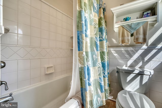 bathroom featuring tile walls and shower / bath combination with curtain