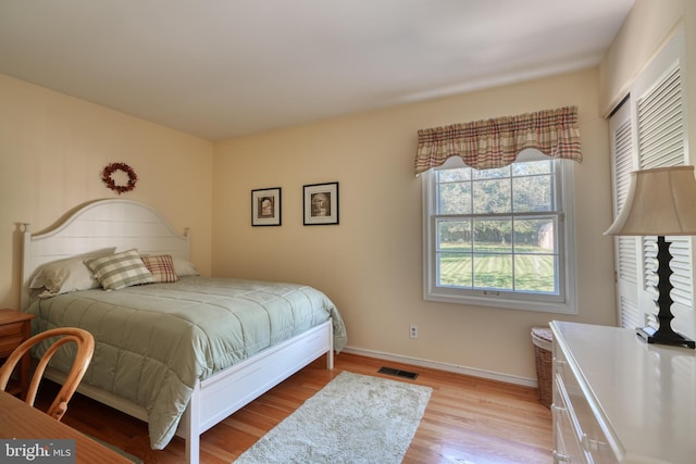 bedroom with light hardwood / wood-style flooring