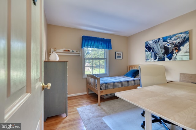 bedroom with wood-type flooring