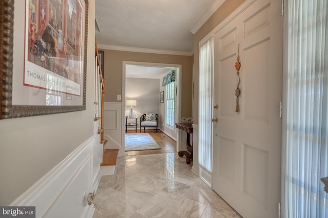 entrance foyer featuring ornamental molding